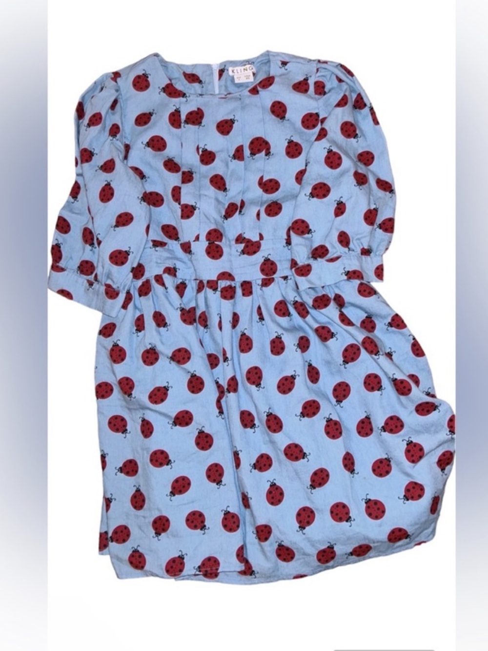 Kling Blue Top with Red Ladybug Print
Spanish boutique